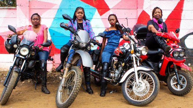 Four Kenyan women on motorcycles